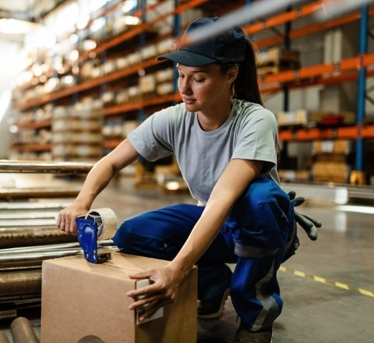 Lady taping the box